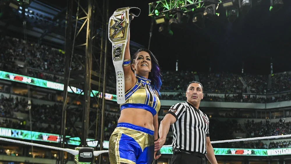 Bayley pointing to the crowd after winning the WWE Women's Championship at WrestleMania XL