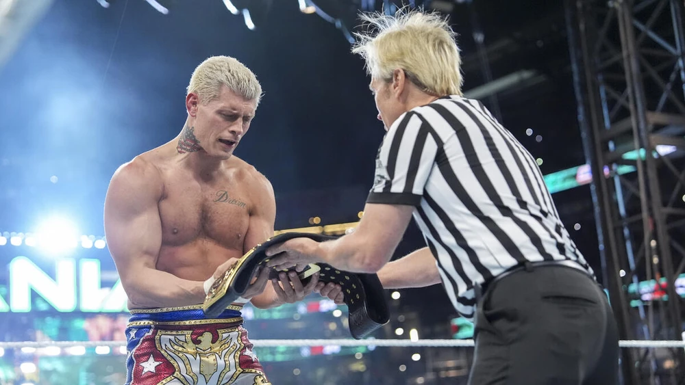 Cody Rhodes holding the Undisputed WWE Universal Championship aloft after defeating Roman Reigns at WrestleMania XL