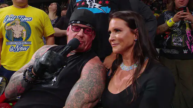The Undertaker and Stephanie McMahon sitting together at ringside at WWE WrestlePalooza 2025.